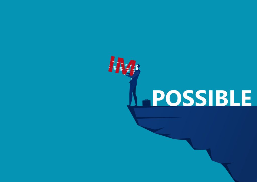 Man shifting 'Impossible' to 'Possible,' symbolizing turning challenges into opportunities.